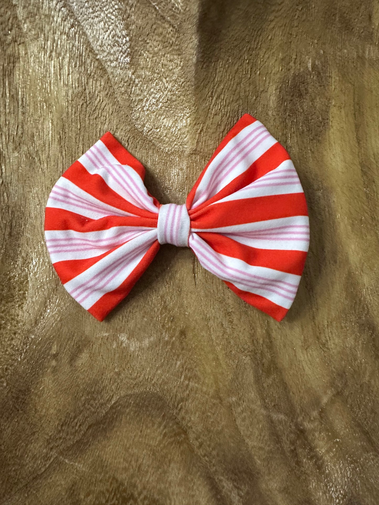 Red and pink striped clip on bow