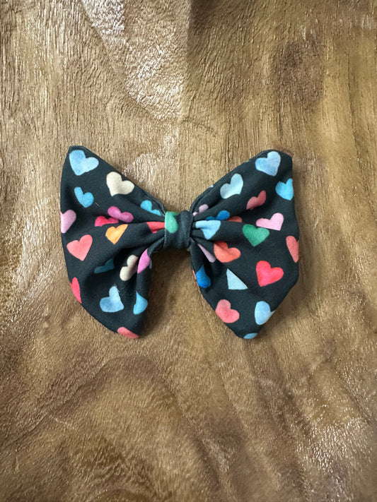 Colorful hearts clip on bow, black